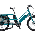 Teal Blix Packa Genie Step-Thru electric cargo eBike with 750W motor, shown from the side with cargo rack attached