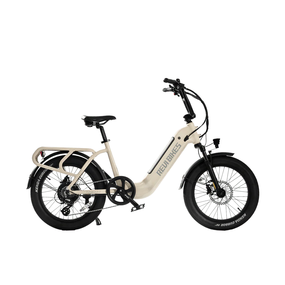 A white REVI Runabout 2 Step Thru electric bike with 20x3 fat tires, rear cargo rack, and 750w motor, shown from the side against a plain background.
