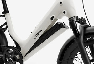 Side view of the Urtopia Carbon Joy eBike in Creme color, showcasing its lightweight carbon frame, sleek design, and integrated battery against a plain background.