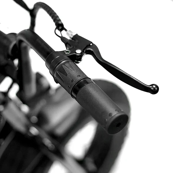 Side view of the eMOTO eBike Strike Big Boy electric bicycle, showcasing its sturdy frame, large tires, and battery pack mounted on the downtube.