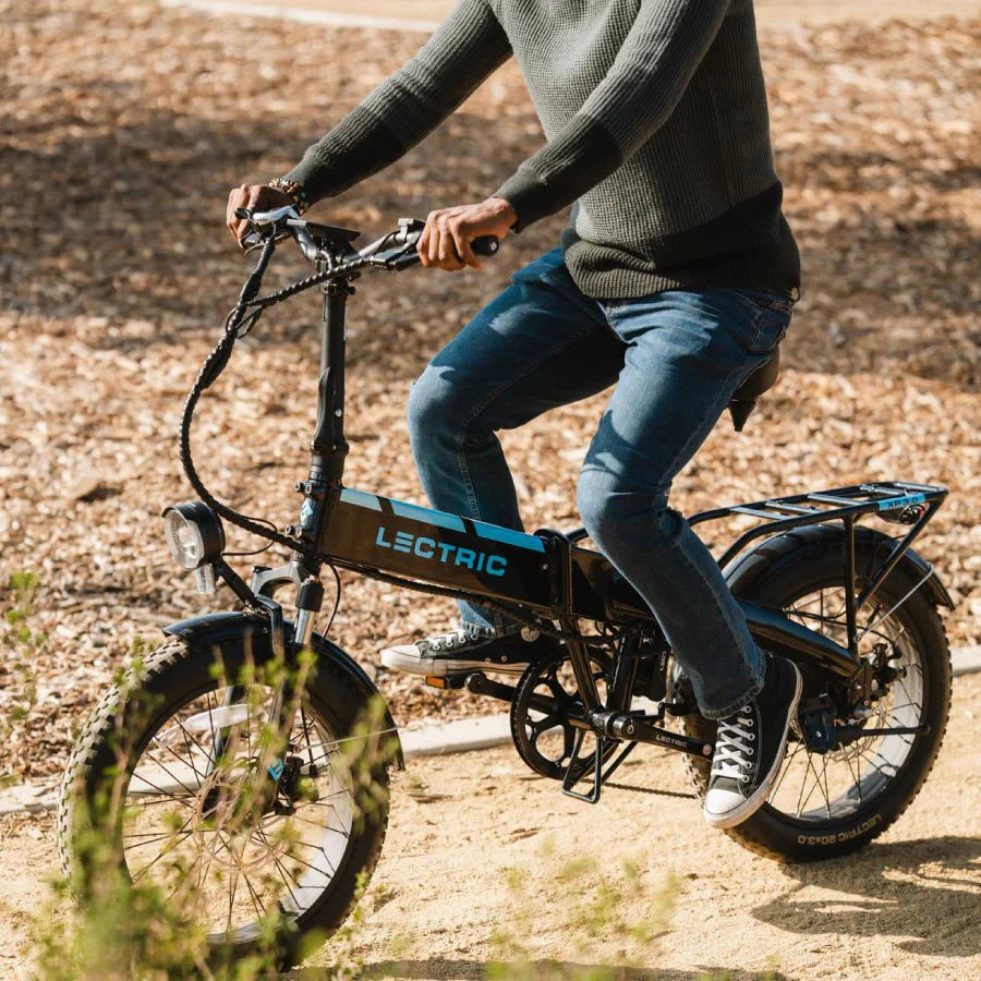 Alt text: LECTRIC XP 3.0 long-range 500W fat tire folding eBike, black, displayed in-store
