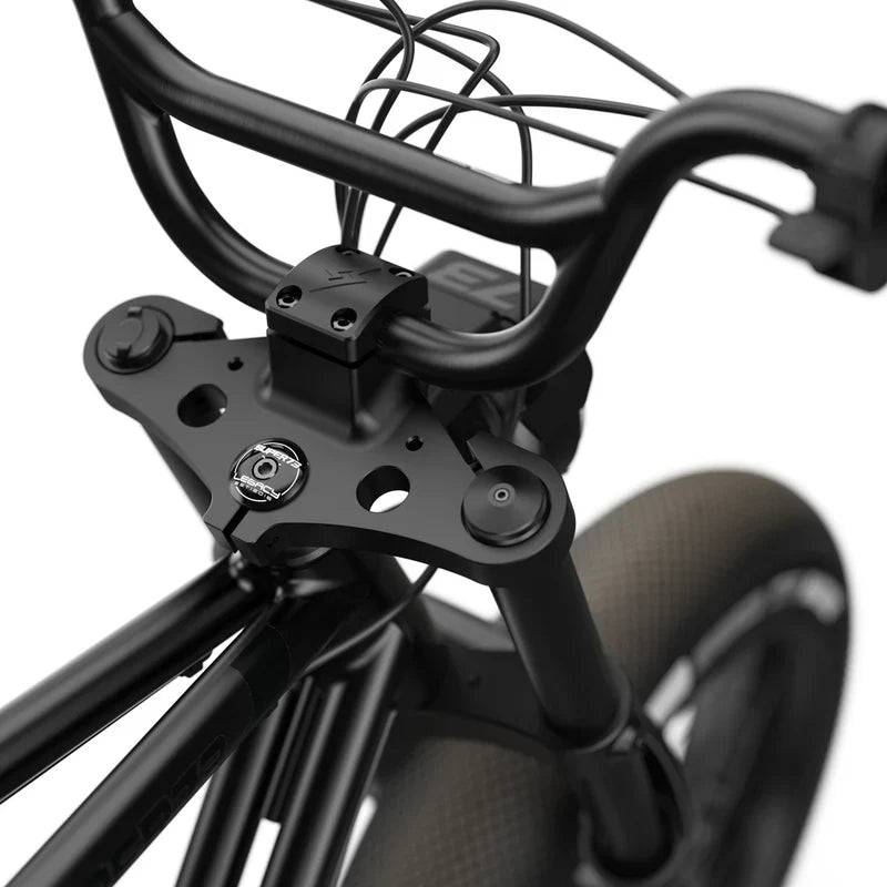 Side view of the Super73 ZX SE electric bike in blackout color, showcasing its sleek black frame, thick tires, and minimalist design against a plain background.