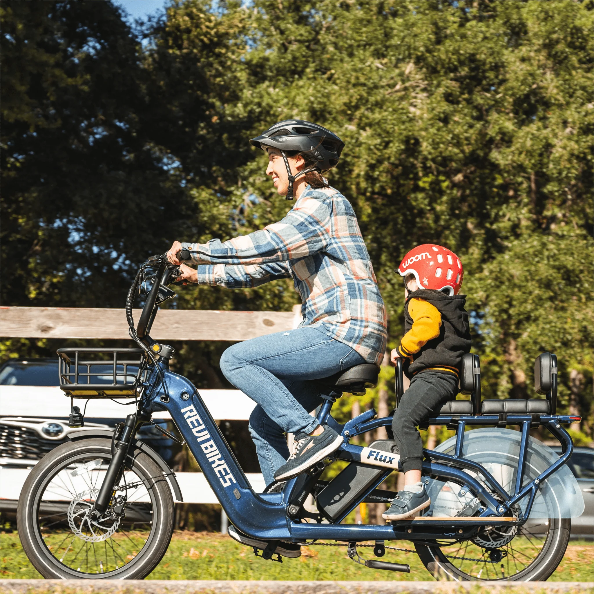 A REVI Flux 750w Step Thru electric bike with 20x2.4 inch fat tires, shown as a compact cargo eBike in a product image.