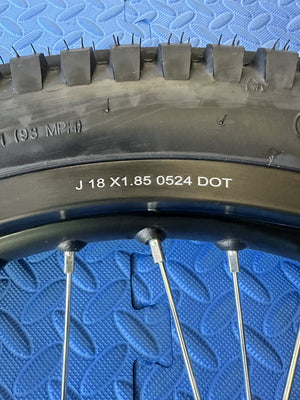 Surron eMoto wheel set with Shinko 241 dual sport tires, 18-inch rear and 21-inch front wheels for moto bikes, shown without rotor or sprocket.