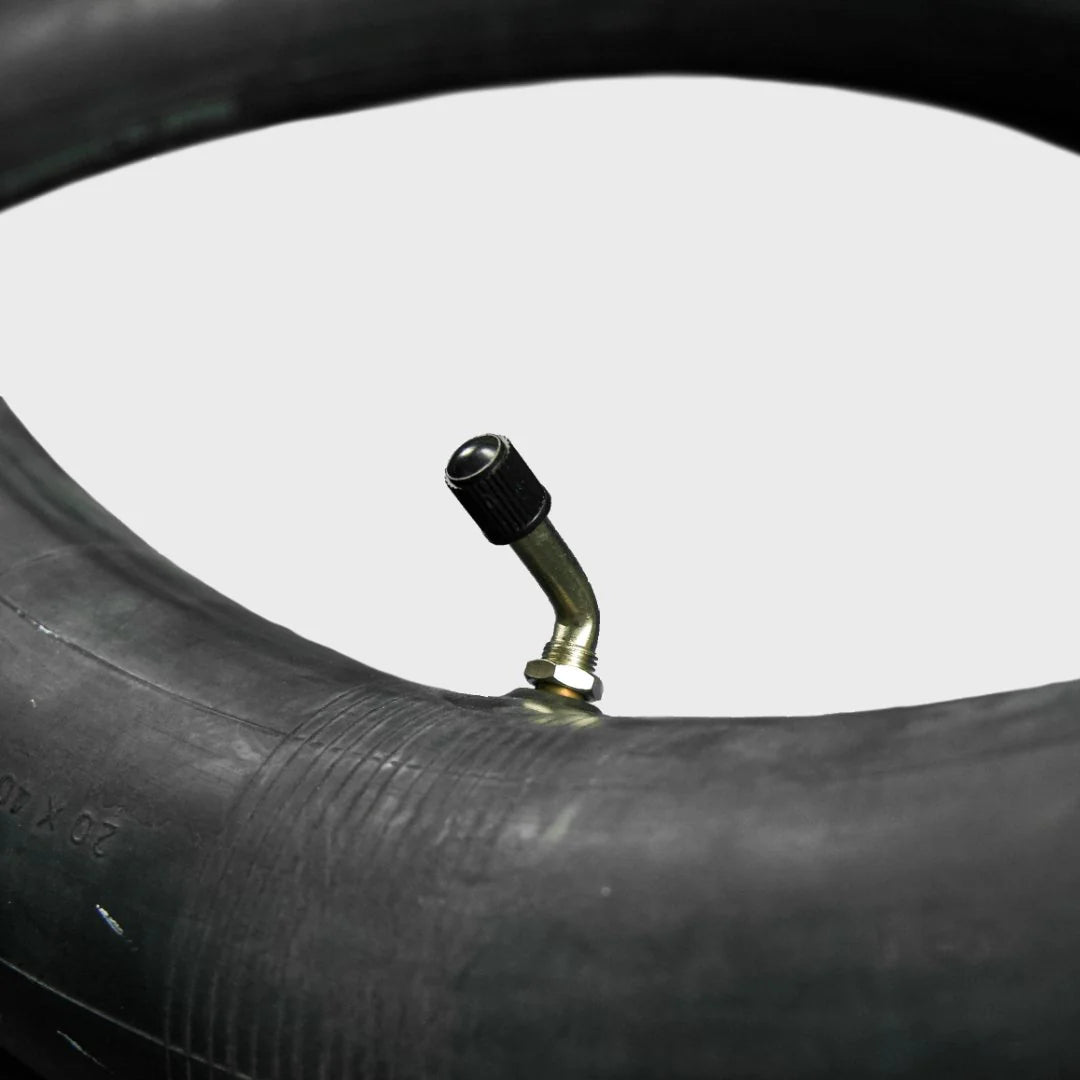 A 20x4.5/5.0-406 eBike inner tube from Tire Co. displayed coiled with a visible valve stem, set against a plain background.