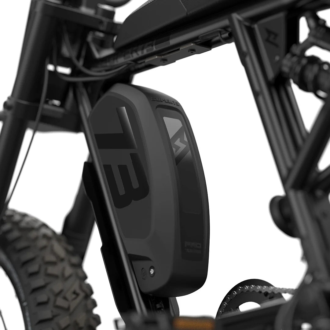 Side view of the Super73 R Adventure Series SE electric bike in a rugged outdoor setting, showcasing its thick tires, sturdy frame, and adventure-ready design.