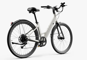 Side view of the Urtopia Carbon Classic Step Thru eBike in creme color, showcasing its lightweight carbon frame, step-through design, and sleek modern styling against a plain background.