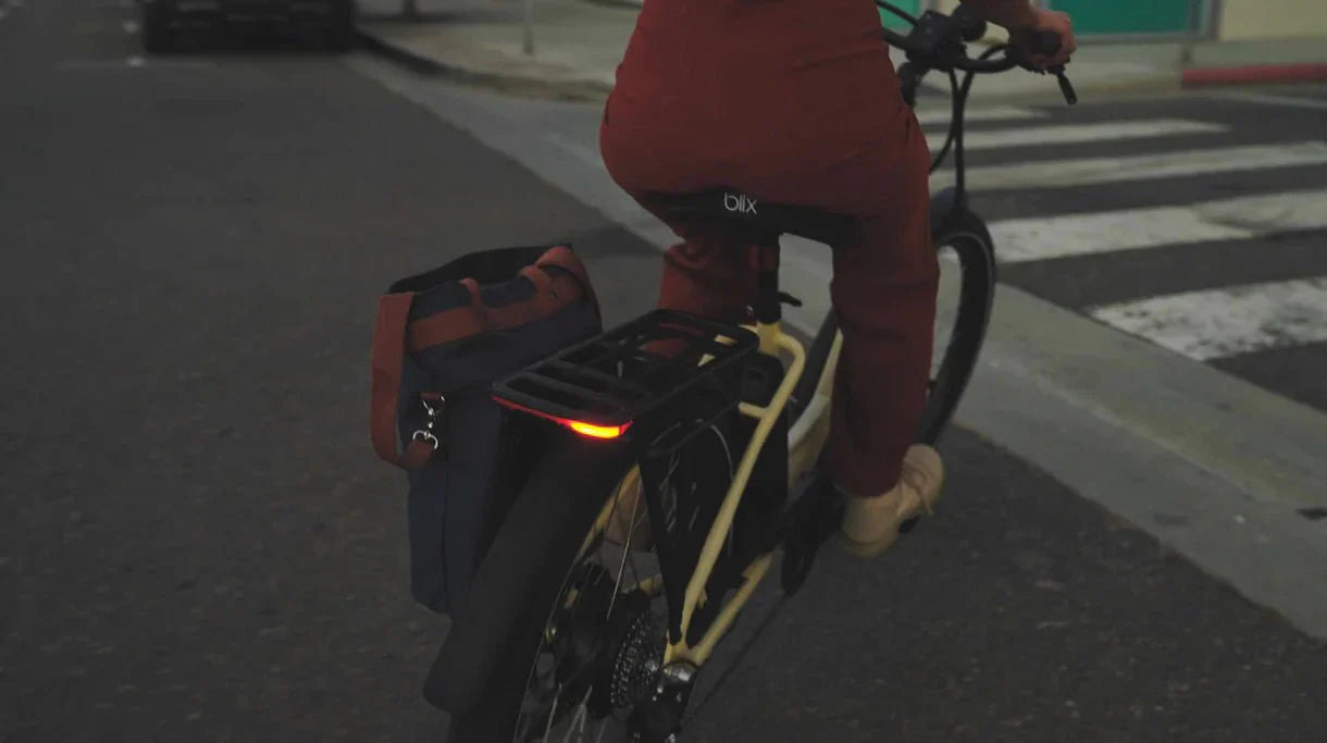 Green Blix Sol X Step Over electric beach cruiser eBike with 750W motor, shown in a product image.