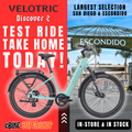 Mint green Velotric Discover 2 eBike in original box, product image on white background.