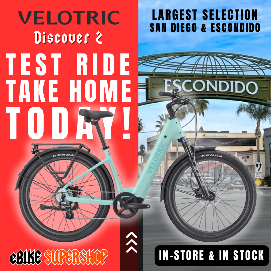 Mint green Velotric Discover 2 eBike in original box, product image on white background.