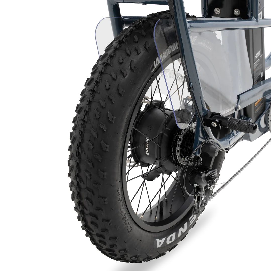 A black Murf Higgs Plus eBike parked on a paved path, featuring fat tires, a sturdy frame, and a rear cargo rack, with greenery in the background.