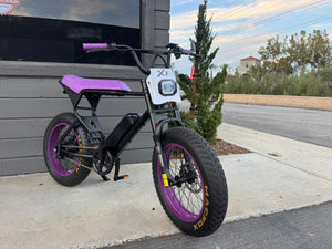 Black and purple eMOTO eBike Macfox X1S CUSTOM, ready to ride, side view against a plain background.