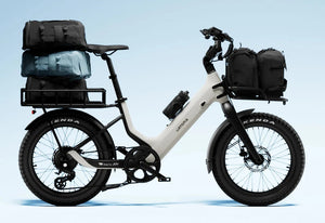 Side view of the Urtopia Carbon Joy Ultra eBike in black, showcasing its lightweight carbon frame, integrated battery, and sleek modern design against a plain background.