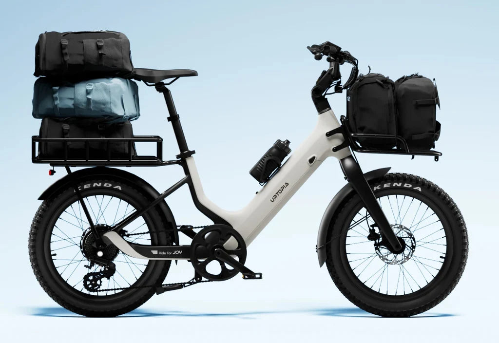 Side view of the Urtopia Carbon Joy Ultra eBike in black, showcasing its lightweight carbon frame, integrated battery, and sleek modern design against a plain background.