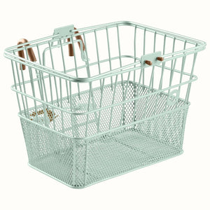 Retrospec Apollo steel bike basket in matcha green, mounted on an eBike handlebars, side view