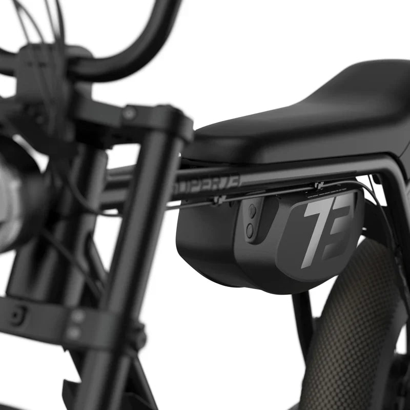 Side view of a Super73 ZX SE electric bike in blackout color, featuring a sleek black frame, thick tires, and minimalist design against a plain background.