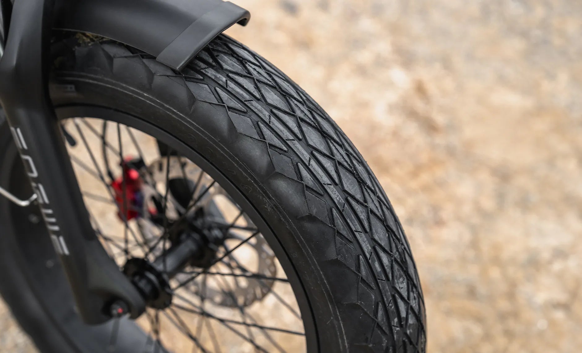 Engwe M20 3.0 electric bike in matte black, shown from a side angle with thick tires, dual headlights, and a sturdy frame, parked on a paved surface.
