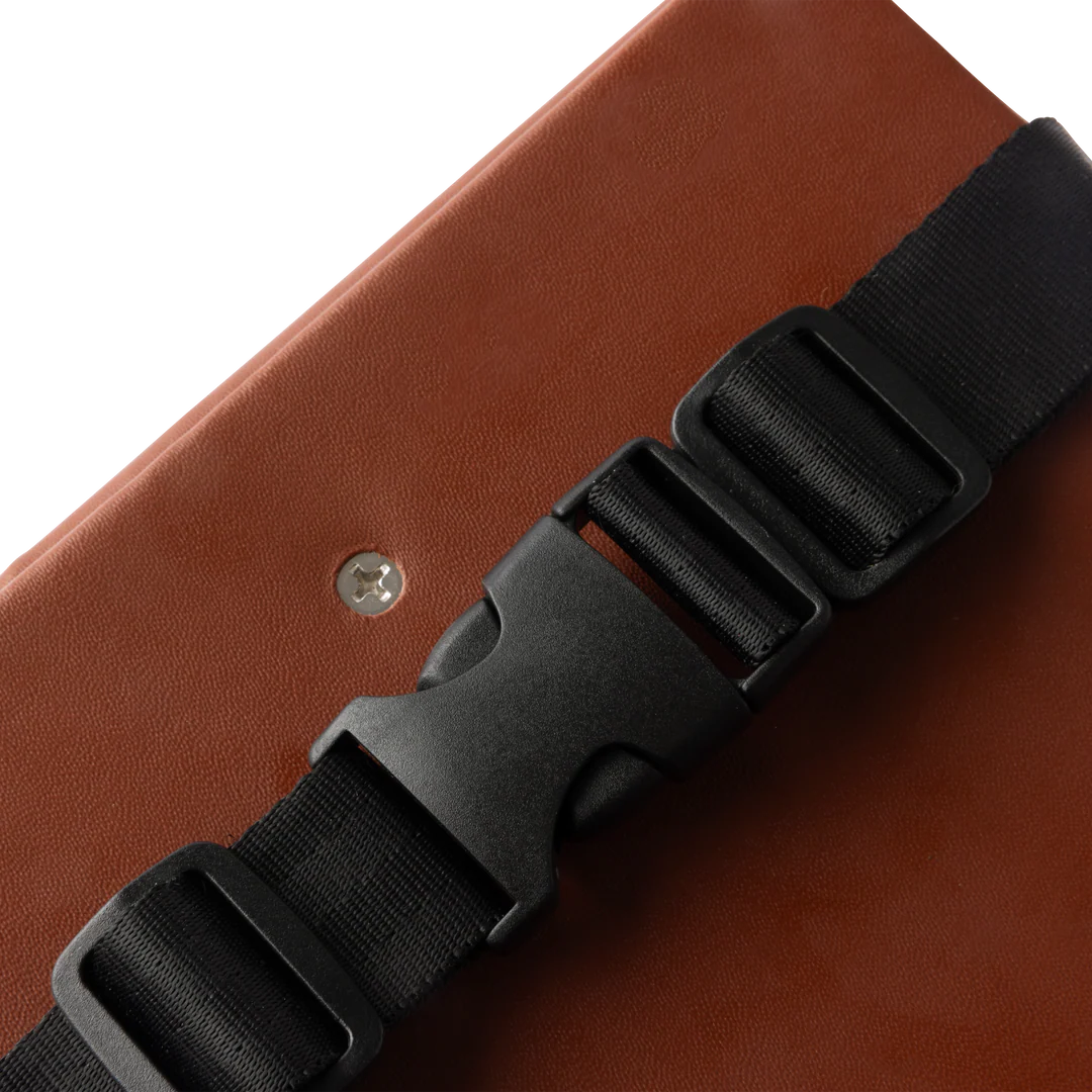 Brown eBike seat pad for Murf cargo bike, shown as a product accessory.