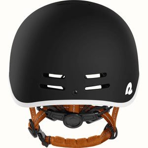 Matte black Retrospec Remi eBike helmet, side view, showing adjustable straps and ventilation holes.