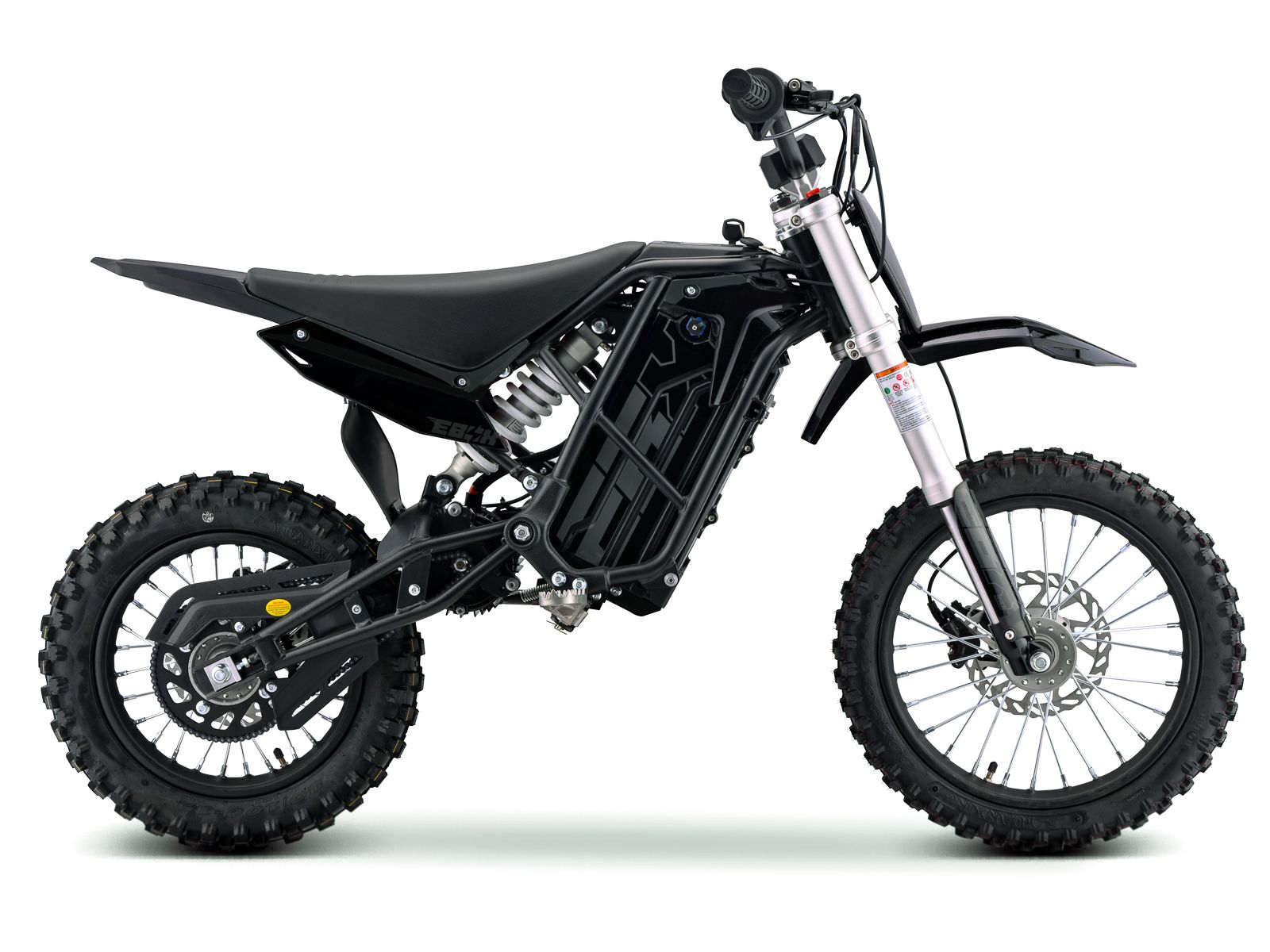 Electric dirt bike eMOTO Stomp Ebox V3 60, side view, black and green color scheme, knobby tires, sturdy frame, and visible battery compartment.