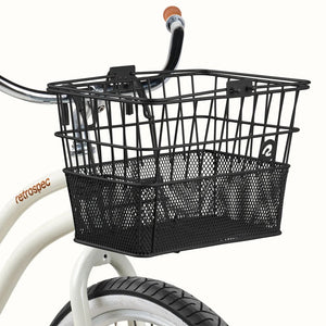 Black Retrospec Apollo steel bike basket attached to the front of an eBike