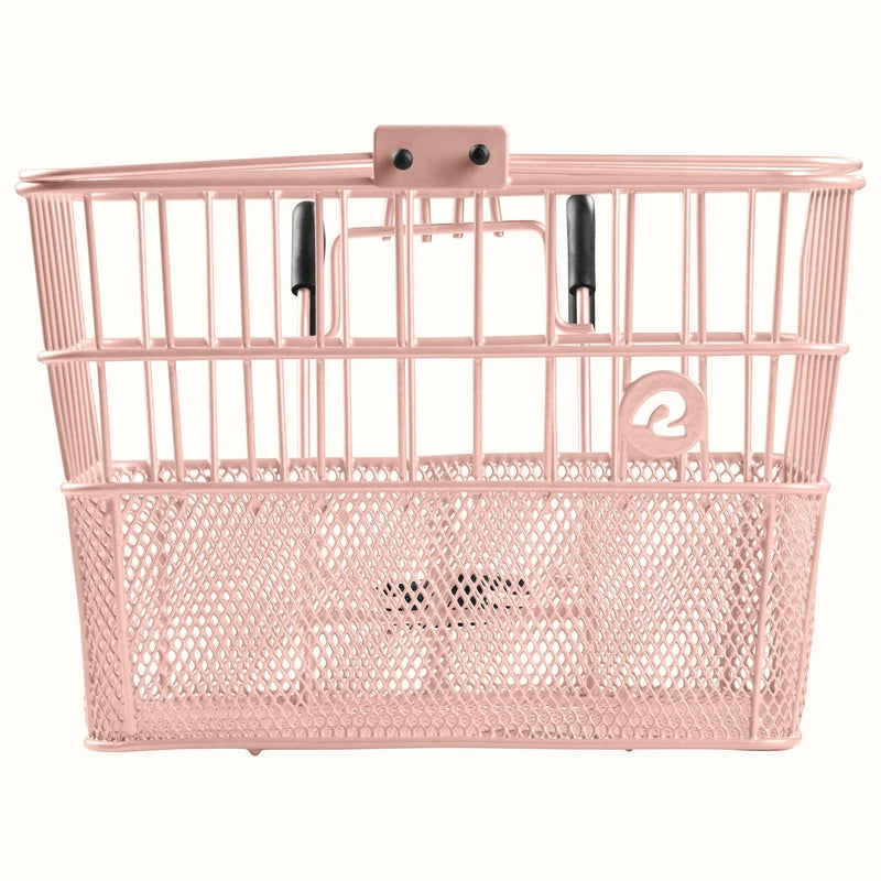 Blush pink Retrospec Apollo steel bike basket attached to the front of an eBike