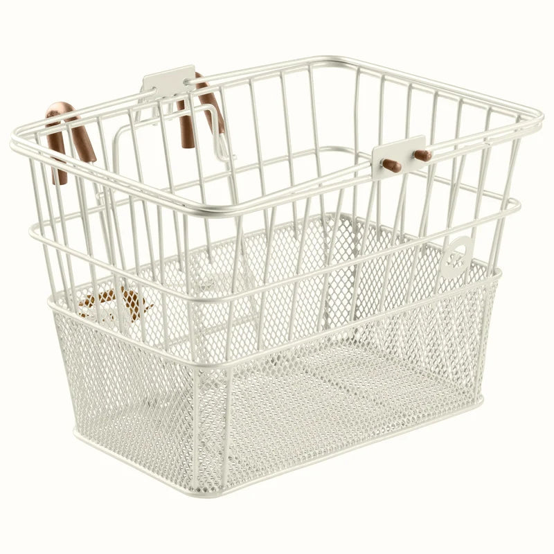 Retrospec Apollo steel bike basket in eggshell color, mounted on an eBike, product image.