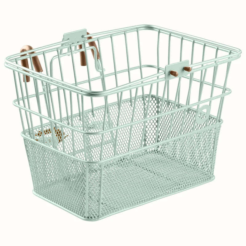 Retrospec Apollo steel bike basket in matcha green, mounted on an eBike handlebars, side view