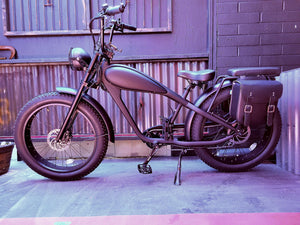 Black Cheetah electric fat-tire custom eBike, side view, against a plain background