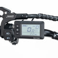 Alt text: Macfox X2 eBike display unit showing speed, battery level, and other ride information, mounted on handlebars.