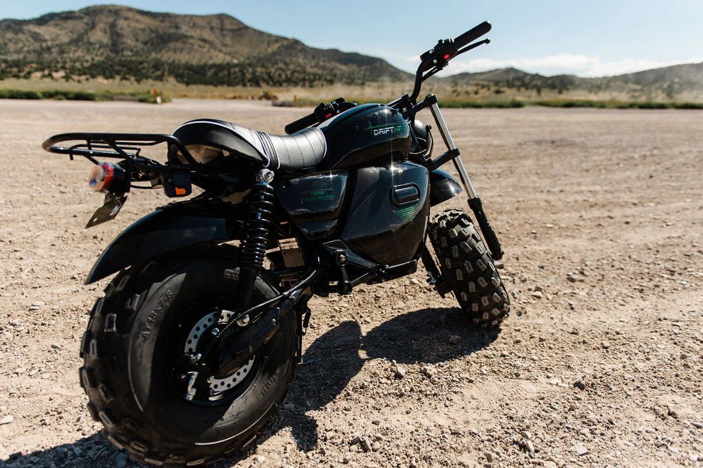 A black and red eBike Drift Hero 1500w Mini electric bike with thick tires, compact frame, and sporty design, displayed on a white background.
