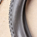 A black 26x4 Chao Yang fat tire mounted on an eBike wheel, showcasing the tread pattern and sidewall branding.