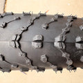 A black eBike with 26x4 inch Kenda Juggernaut fat tires, shown in a side profile against a white background.