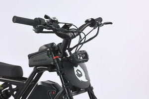 Electric bike Ghostcat F3 Class 2, side view, black frame, thick tires, front suspension, battery mounted on downtube, kickstand extended, white background.