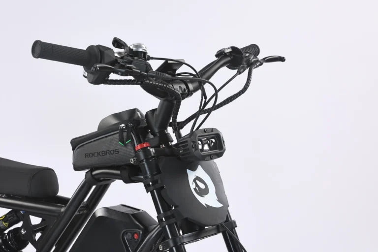 Electric bike Ghostcat F3 Class 2, side view, black frame, thick tires, front suspension, battery mounted on downtube, kickstand extended, white background.