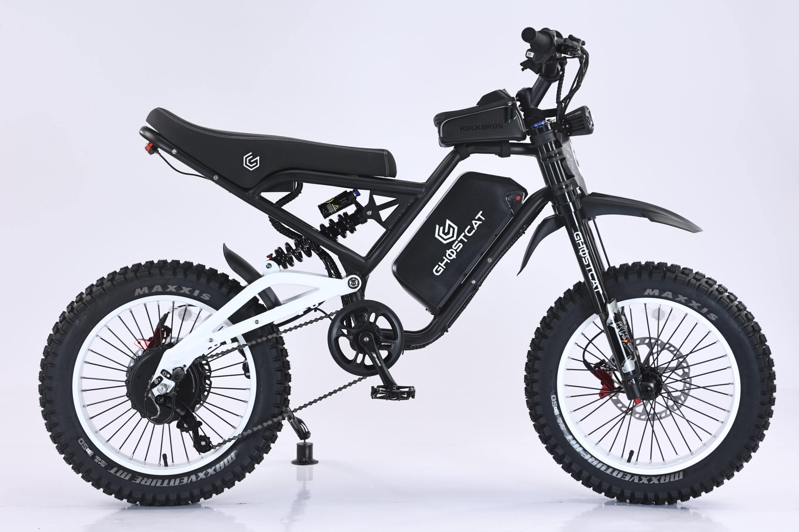White eBike Ghostcat F4X side view, showcasing frame design, wheels, and handlebars against a plain background.