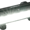 A black eBike light bar mounted on bicycle handlebars, featuring multiple LED lights and a sleek, compact design.