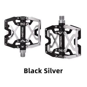 Close-up of MZYRH aluminum eBike pedals in black and silver, showing the pedal's textured surface and durable metal construction.