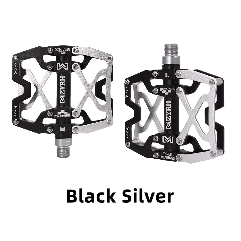 Close-up of MZYRH aluminum eBike pedals in black and silver, showing the pedal's textured surface and durable metal construction.
