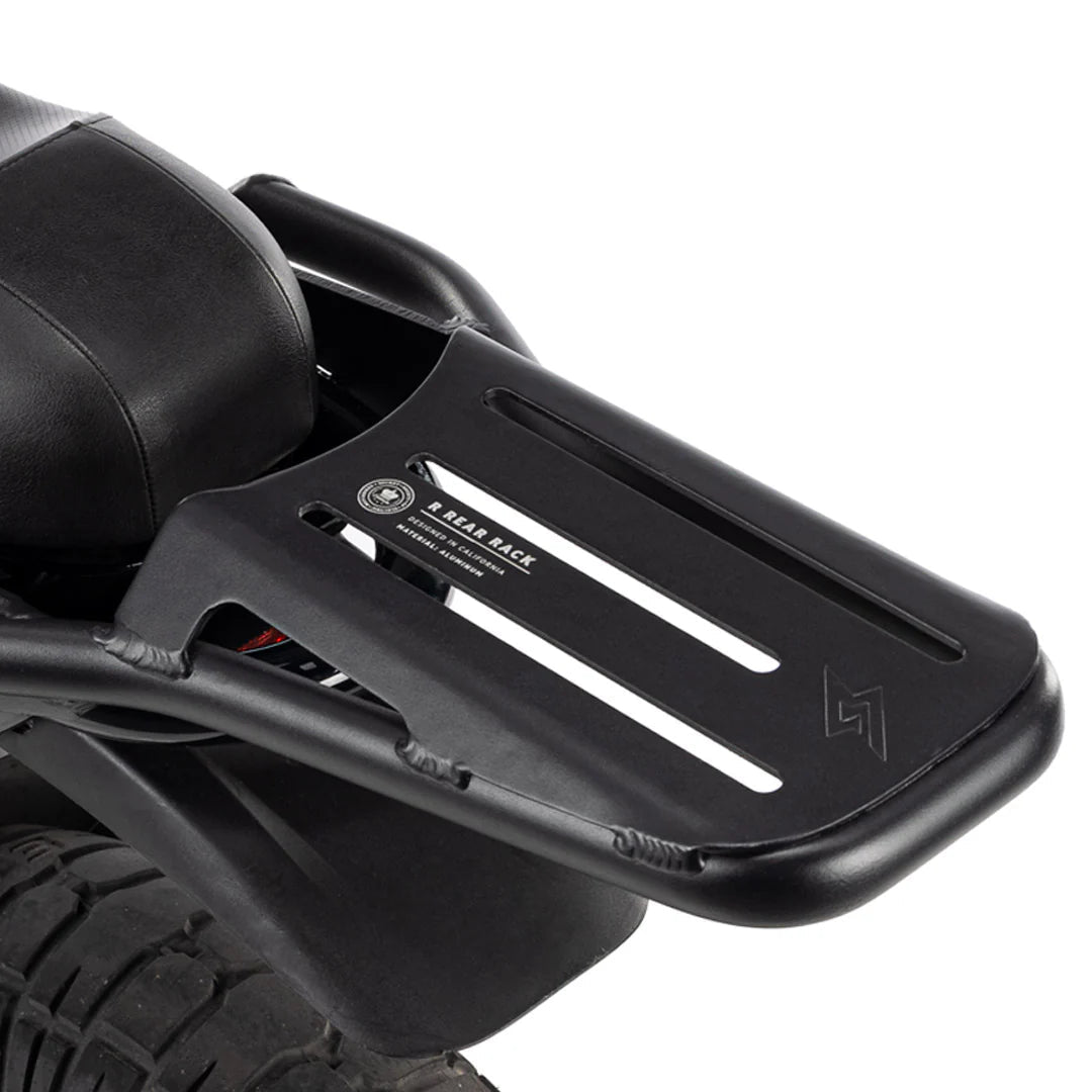 Side view of a Super73 R-Series electric bike equipped with a black rear rack mounted above the back wheel.