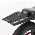 Rear view of a Super73 Z/ZX electric bike equipped with a black rear rack, showcasing the rack's design and mounting position above the back wheel.