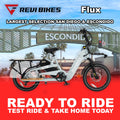 Gray eBike Revi Flux electric bicycle side view with black tires and sleek frame design