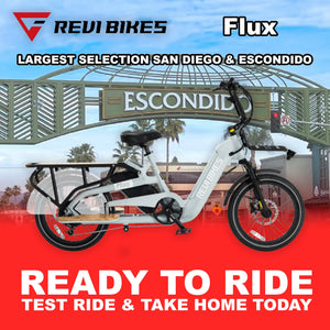 Gray eBike Revi Flux electric bicycle side view with black tires and sleek frame design