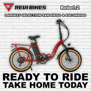Red eBike Revi Rebel.2 R2R electric bicycle, side view, against a white background
