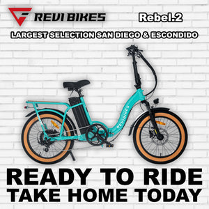 Turquoise eBike Revi Rebel.2 R2R electric bicycle, side view, against a white background