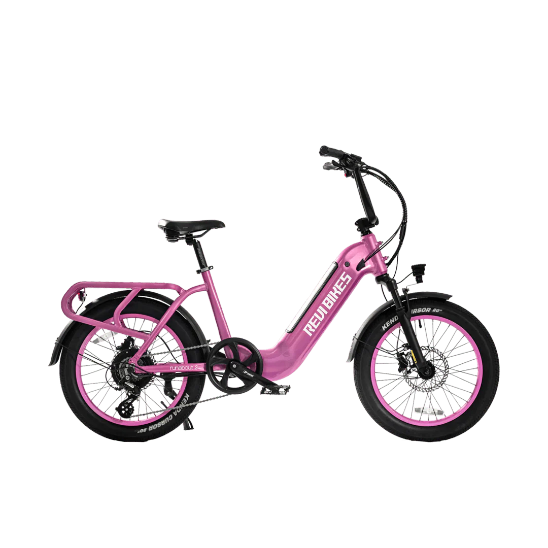 Pink REVI Runabout 2 Step Thru 750w mini electric cargo eBike with 20x3 fat tires, shown from the side.