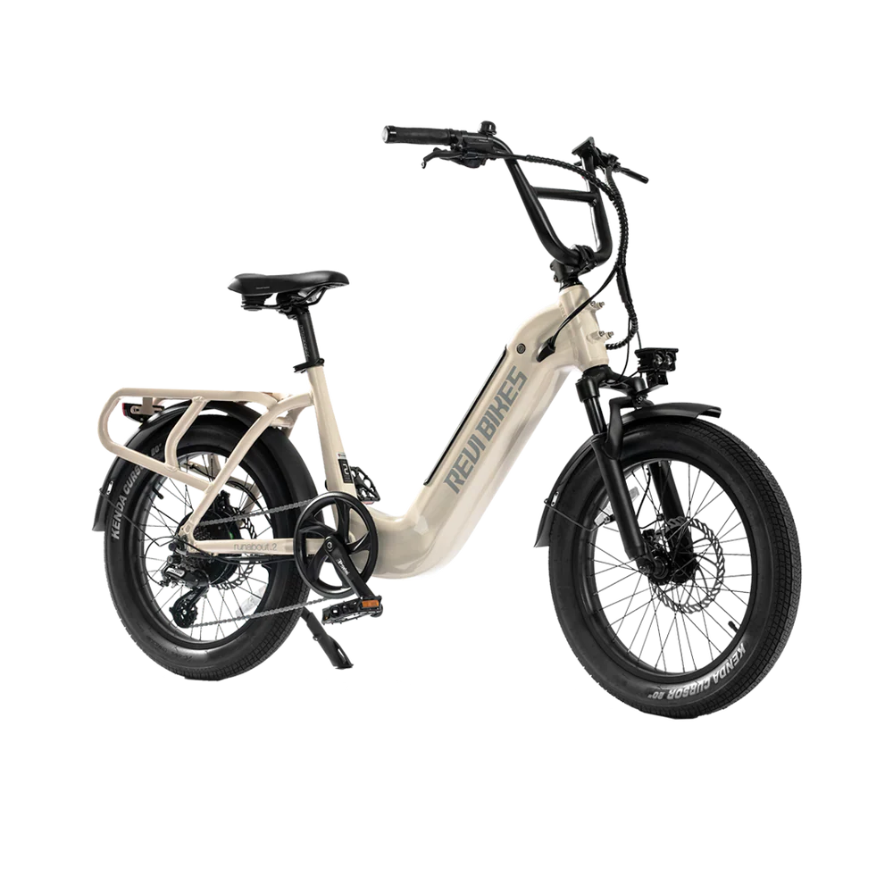 Cream-colored eBike Revi Runabout.2 electric bicycle, side view, displayed on a white background.