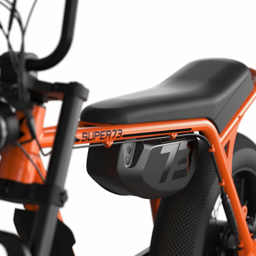 Super73 Z Miami SE electric bike in Astro Orange, side view, against a white background