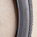 Product image of a Kenda Kwick Seven.5 eBike tire, size 27.5x2.20, showing the tread pattern and sidewall branding.
