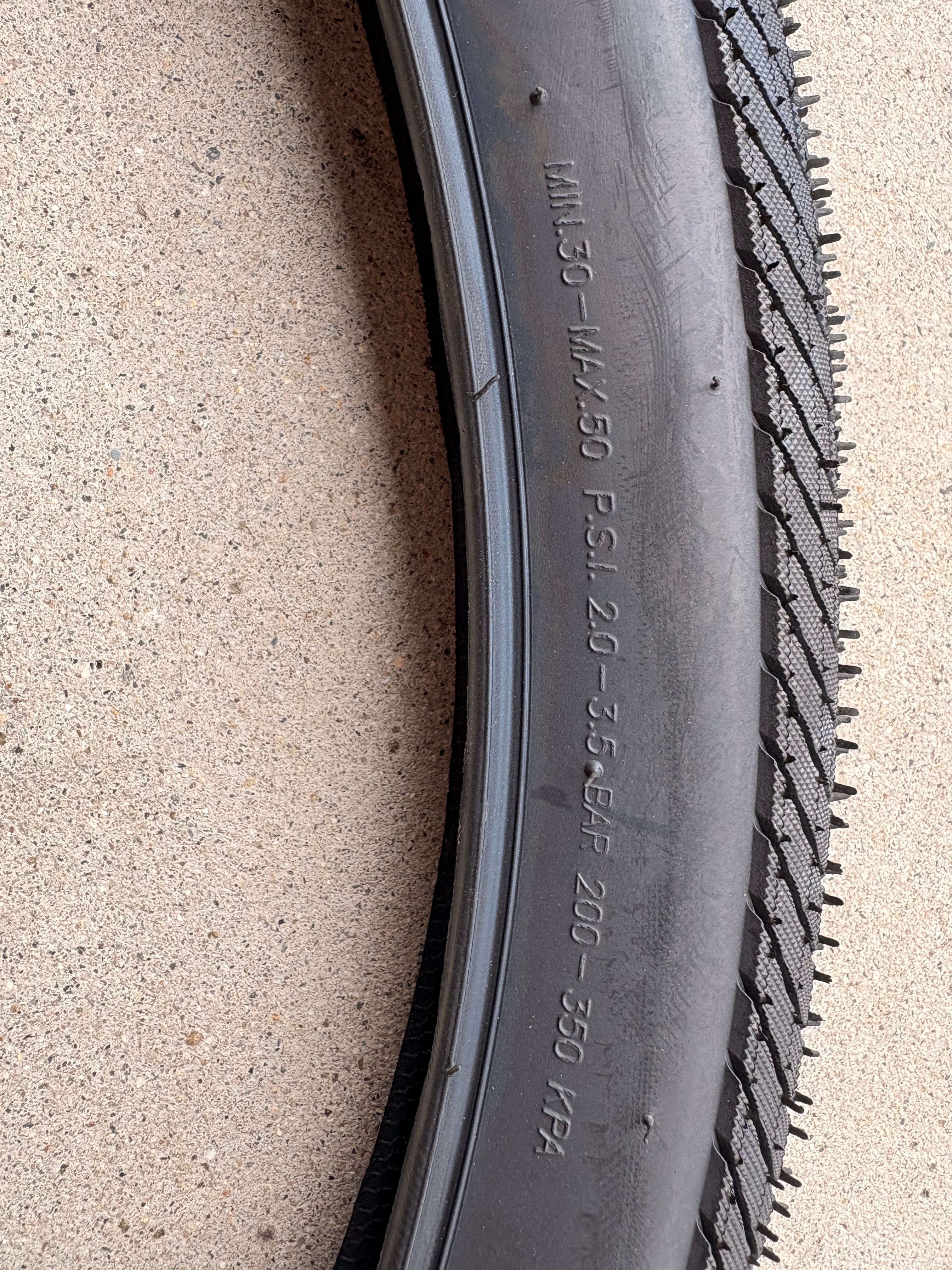 Product image of a Kenda Kwick Seven.5 eBike tire, size 27.5x2.20, showing the tread pattern and sidewall branding.